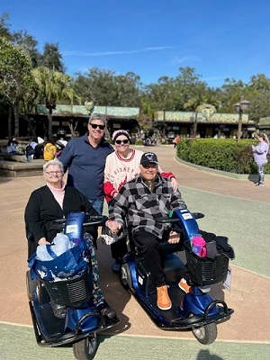 Shelly, her brother, mom and dad at Disney 2025